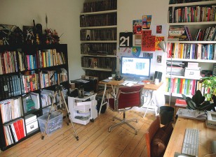 Tom Muller's office, with comic collection and comic work close by